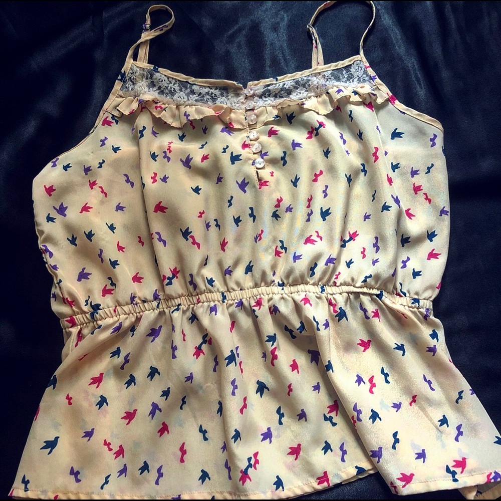 A dressy bird printed blouse, size large.